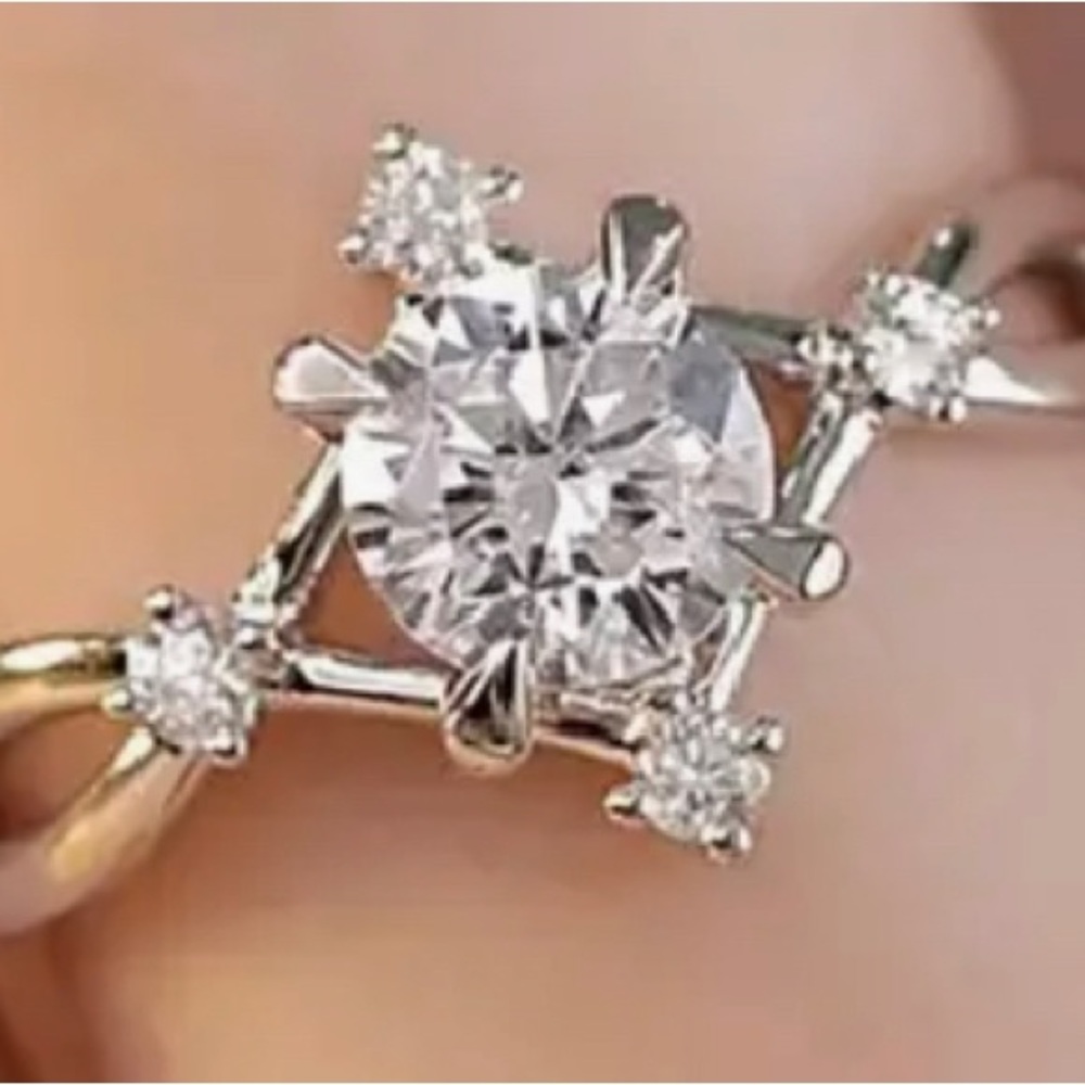 One carat round zirconia set in sterling silver plating with four zircons Size 9